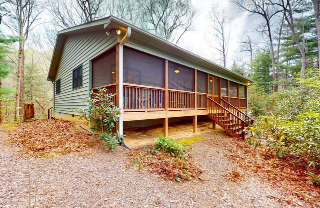 Mountainside abode with a wood stove, firepit, grill, sunroom, AC, and W/D