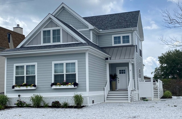 New 5 bedroom & 6 bathroom waterfront home on canal with pool close to beach!