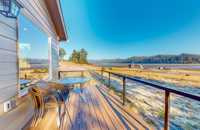 Newly built home with gorgeous water view, spacious deck, 2 kitchens & firepit