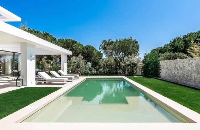 Newly designed villa with heated pool, 5 bedrooms ensuite, 5min walk from beach