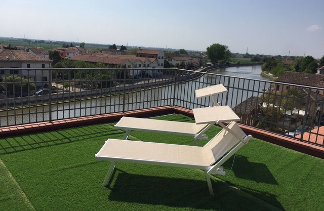 Palazzo Spada - App. Flamingo penthouse with terrace overlooking the Po River