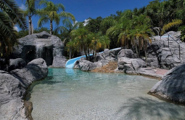 Private 6.5 area estate with pool, waterfall, slide, and jacuzzi