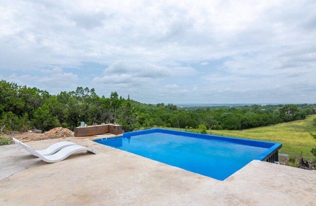 Private container pool with pond and hot tub with views