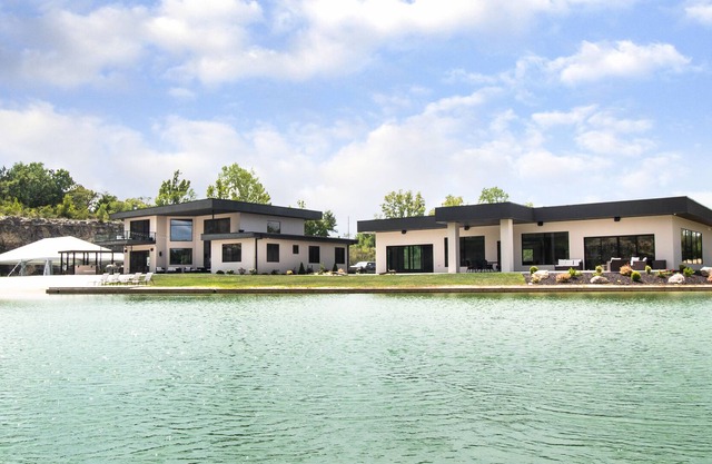 Private luxury 20-acre estate featuring a white sand beach and 8-acre lake