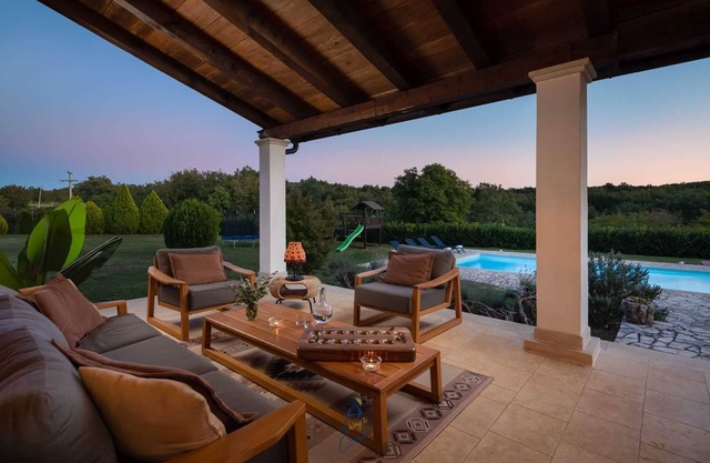 Private villa with pool and playground with lots of land around the villa