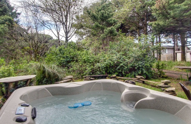 Quiet, dog-friendly home with private hot tub, backyard, & path to beach
