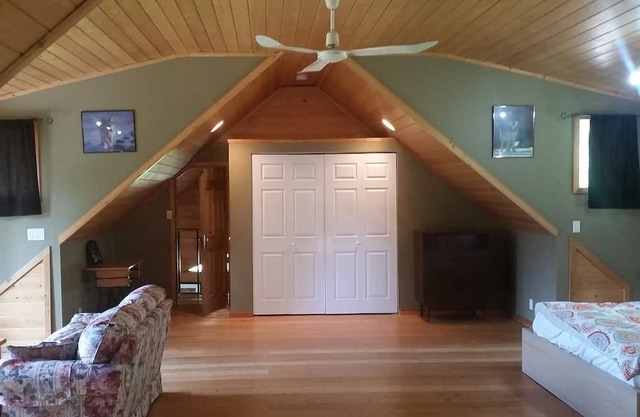 Quiet Lake Front House with great view. Large deck and yard with its own dock!