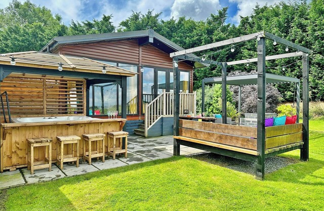 Recently upgraded with Gazebo over hot tub and side bar with stools.