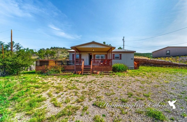 Redman! A single level, cozy cabin on a hill with a direct view of the Ruidoso Downs Racetrack!