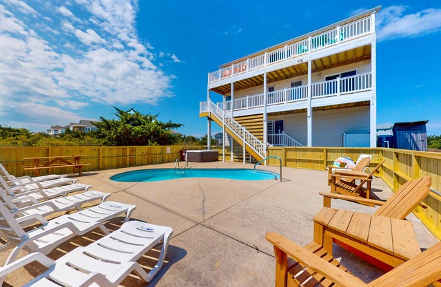 Renovated water-view house with private pool, hot tub, game room, & central AC