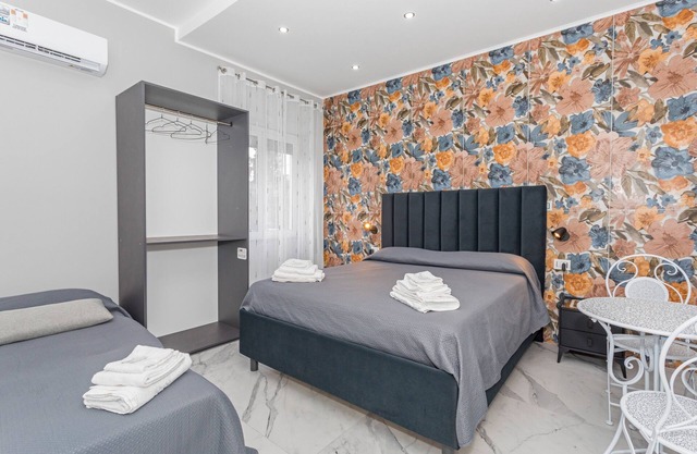 Room 'Dolce Relax - Tripla Luxury' with Wi-Fi and Air Conditioning