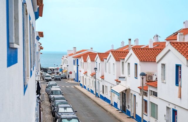 Room 'Quarto 7' in Porto Covo with a Fan