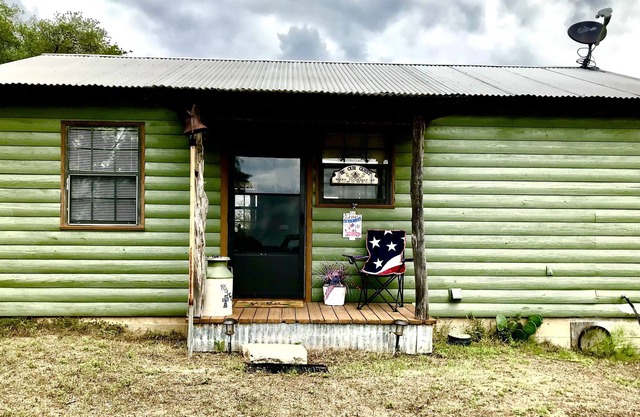 Rustic cabin with peaceful view of windmill, pond and great sunsets. Gated.