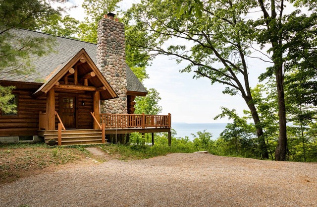 Secluded Log Cabin Retreat on 11 Wooded Acres with Hot Tub & Lake Michigan Views