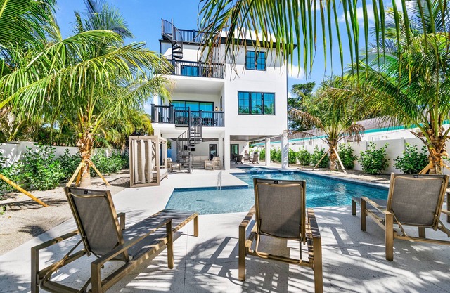 Showstopping home with a Pool, Rooftop Deck, and Games! Sun-Day Style