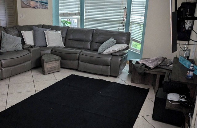 Single Family saltwater pool house with fenced in backyard close to the beach.