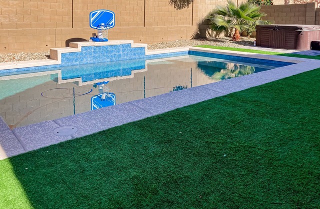 Single-story home with enclosed yard, private pool, hot tub, patio, & grill