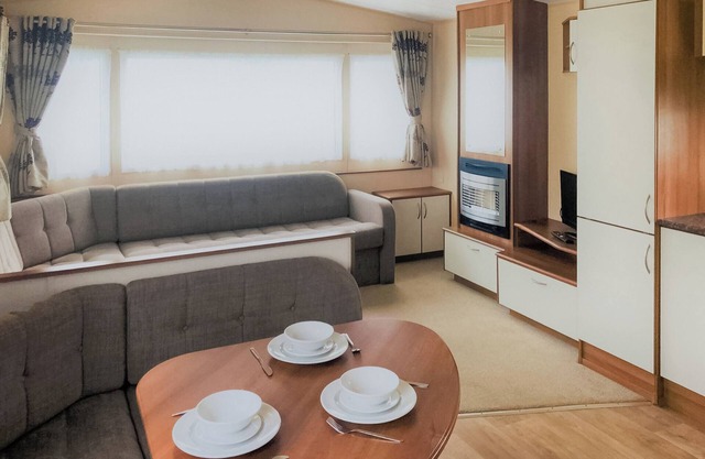 Spacious 12ft wide caravan with one double and one twin.