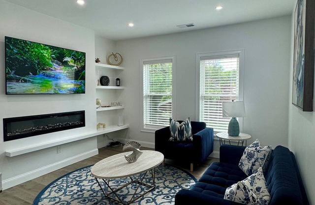 Spacious 3-BR Condo with Modern Fireplace & Full Amenities - Near Downtown