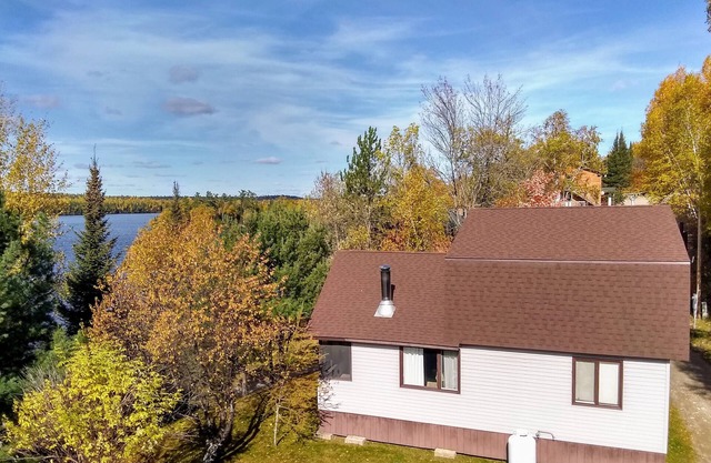 Spacious Group Cabin Overlooking Moose Lake with Vaulted Ceilings, Loft & Porch