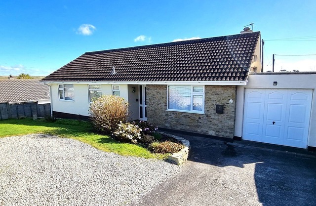 Spacious holiday home with wrap around gardens