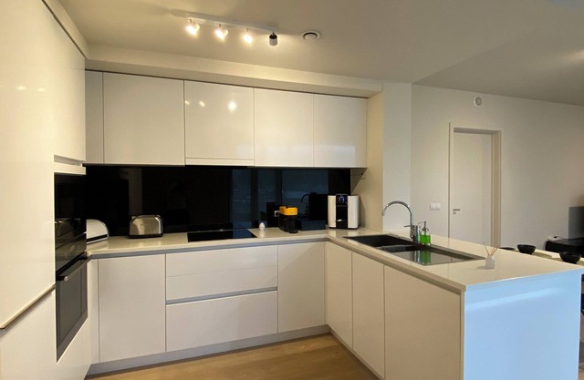 Spacious, modern, comfortable residential apartment in a tower and cab rank near the center.