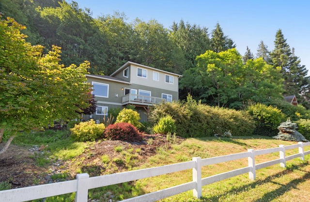 Spacious ocean-view home with forest stream, hot tub, & private community beach