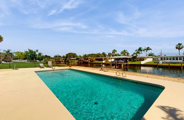 Spacious waterfront home with private pool, sunroom and dock.