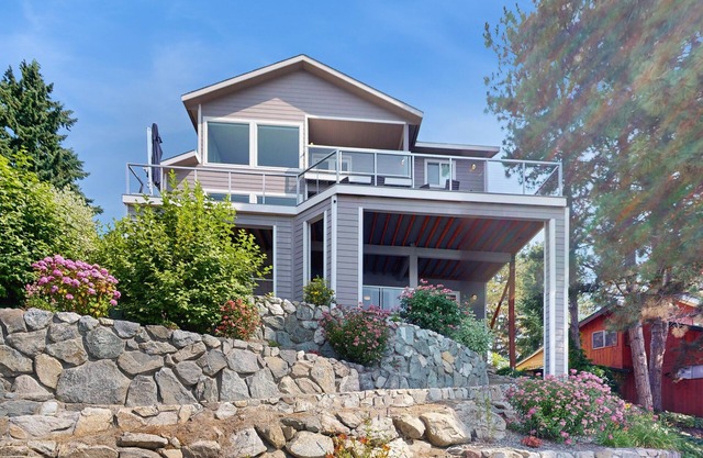 Stunning home on the water with large deck, private dock, firepit