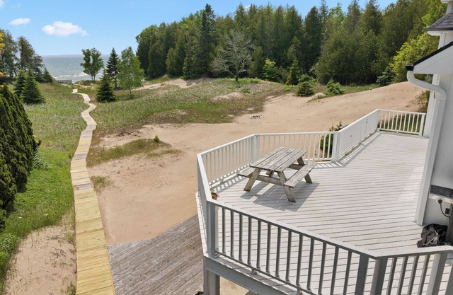 Stunning Lakefront with private sand beach- boardwalk to water!