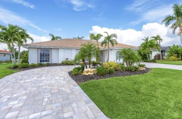 STUNNING! LUXURY WATERFRONT HOME - HEATED POOL- Close to Harbor/Fish Village