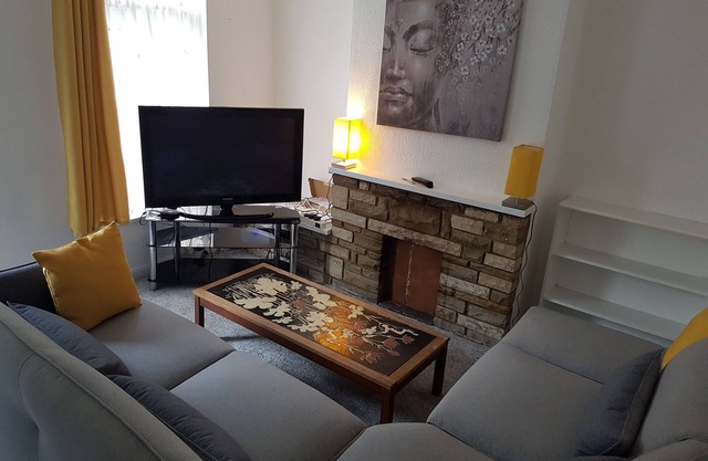 Stylish living with considered workspace.