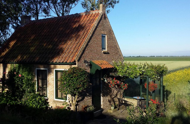 The Cottage is a detached holiday house at the foot of a dike with panorama view