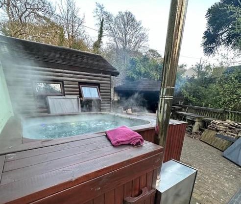 The hot tub by the waterfall - facilities included