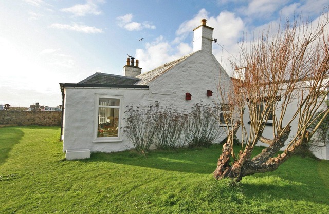 This beach front cottage oozes charm, in a stunning location with sea views.