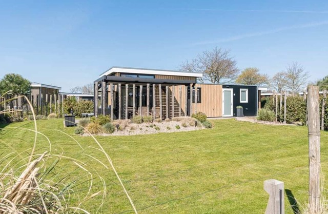 This chalet is beautifully finished both inside and outside. The landscaping, canopy, poster walls a