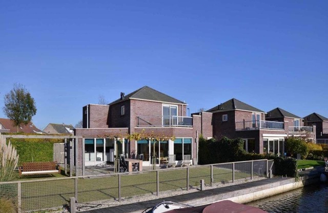 This house is completely surrounded by a fence and it has a trampoline, perfect for children. Beauti