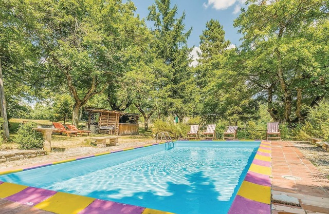 This vacation home, a former farmhouse, is surrounded by lush woods and is located on a 20-hectare p