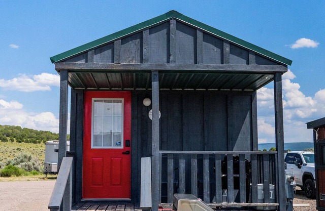Tiny Home with one Queen bed and a Futon couch. Sleeps: 3