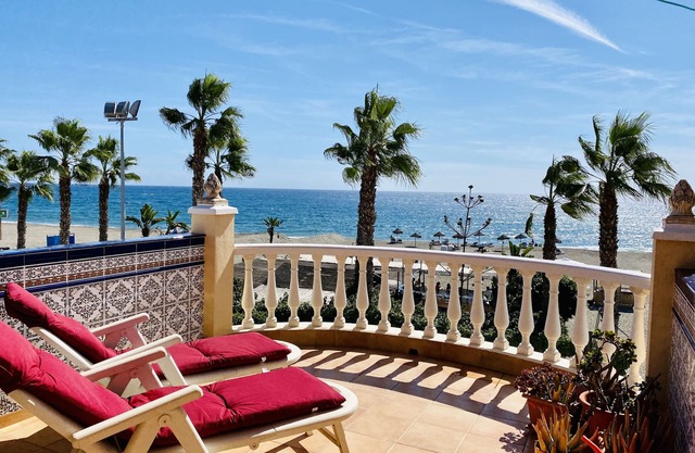 Town house on the beach with large terrace and sea view