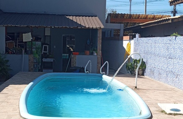 Townhouse with pool and air conditioning near Caraguatatuba shopping mall