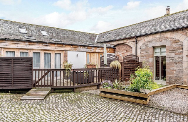 Traditional and stylish converted two storey historic coach house.