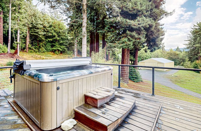 Tranquil and luxe river stay with wraparound deck, hot tub, sauna, & mtn views