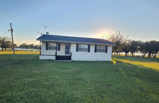 Tranquil Lake House on 2 Acres: Pet-Friendly with Stunning Lake Views.