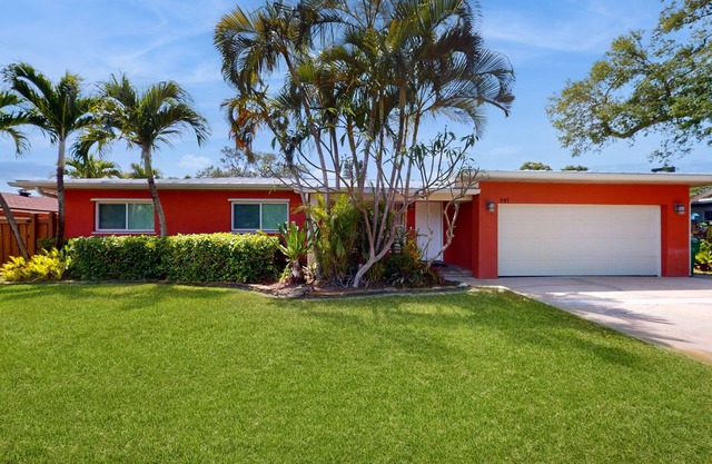 Tropical home with pool, lovely patio & game room - walk to beach