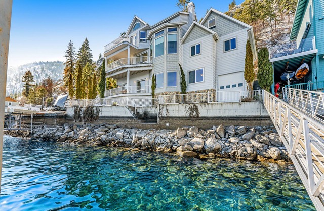 Upscale lakefront house with stunning views & dock spacious interior with fireplace