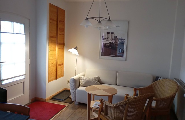 Vacation apartment near the national park and harbor with terrace and parking space