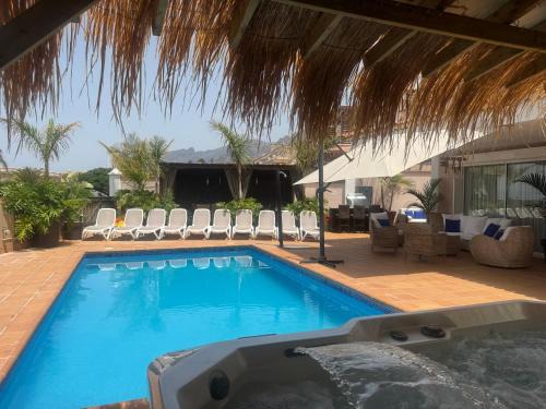 VILLA BLOSSOM in the beautiful area of Puerto Santiago Tenerife with 5 bedrooms for up to 10 guests private swimming pool and many other activities to entertain the family Secure parking for 2 cars and disabled access throughout