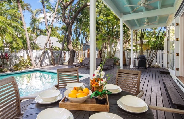 WALKING ON SUNSHINE ~ Exquisite 3 BR, 3 Ba Home w/Heated Pool & Parking!