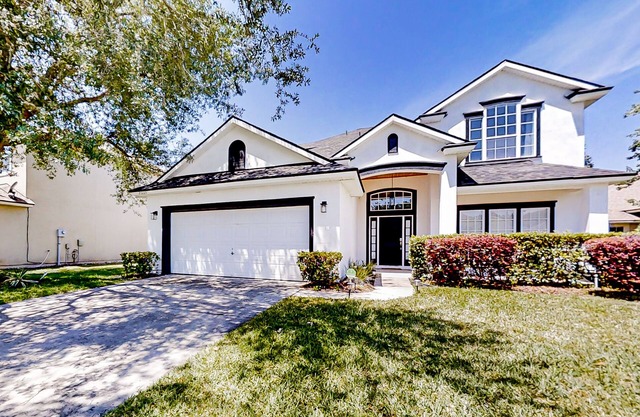 Waterfront 2-story home with water views, patio, streaming, washer/dryer, & AC